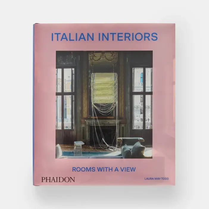 Cover of Italian Interiors: Rooms With A View by Phaidon, featuring a stylish room with large windows and scenic views.