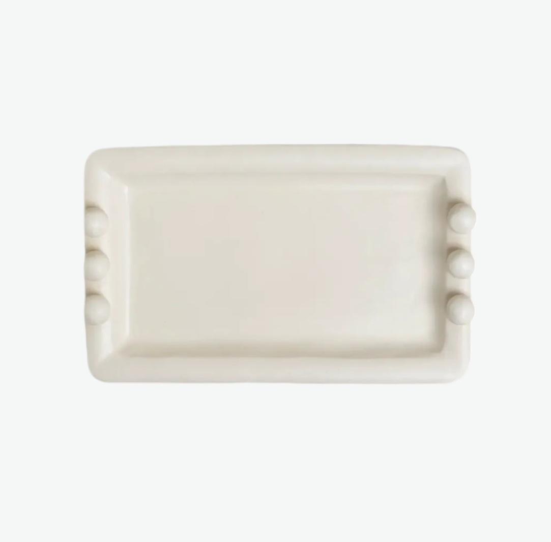 Rectangular ceramic soap dish with decorative elements on a white background
