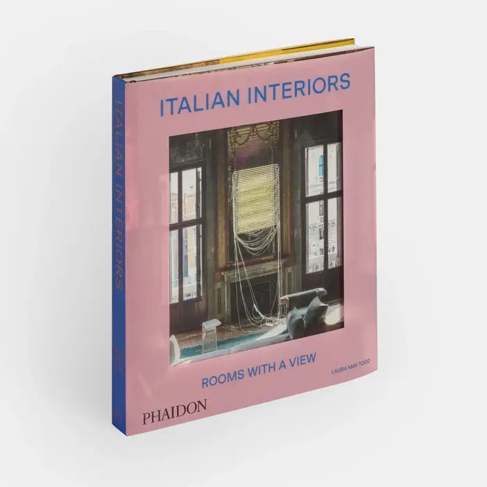 Cover of Italian Interiors: Rooms With A View book by Phaidon, featuring a stylish interior room with large windows and scenic views.