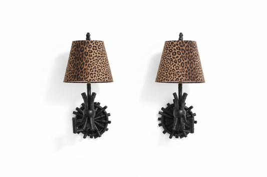 Vintage animal print sconces by The Vault Creative, featuring intricate design and rustic metal details for wall lighting.