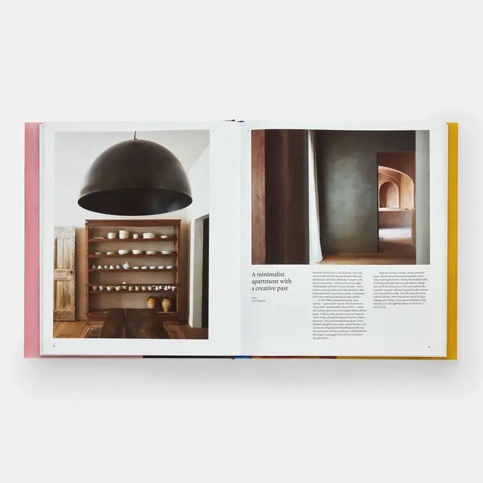 Open book showing pages of Italian Interiors: Rooms With A View by Phaidon, featuring photos of beautifully designed Italian rooms and interiors.