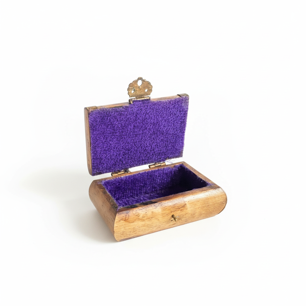 Open wooden box with purple interior on a dark surface