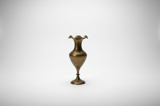 Bronze decorative vase on a white surface 
