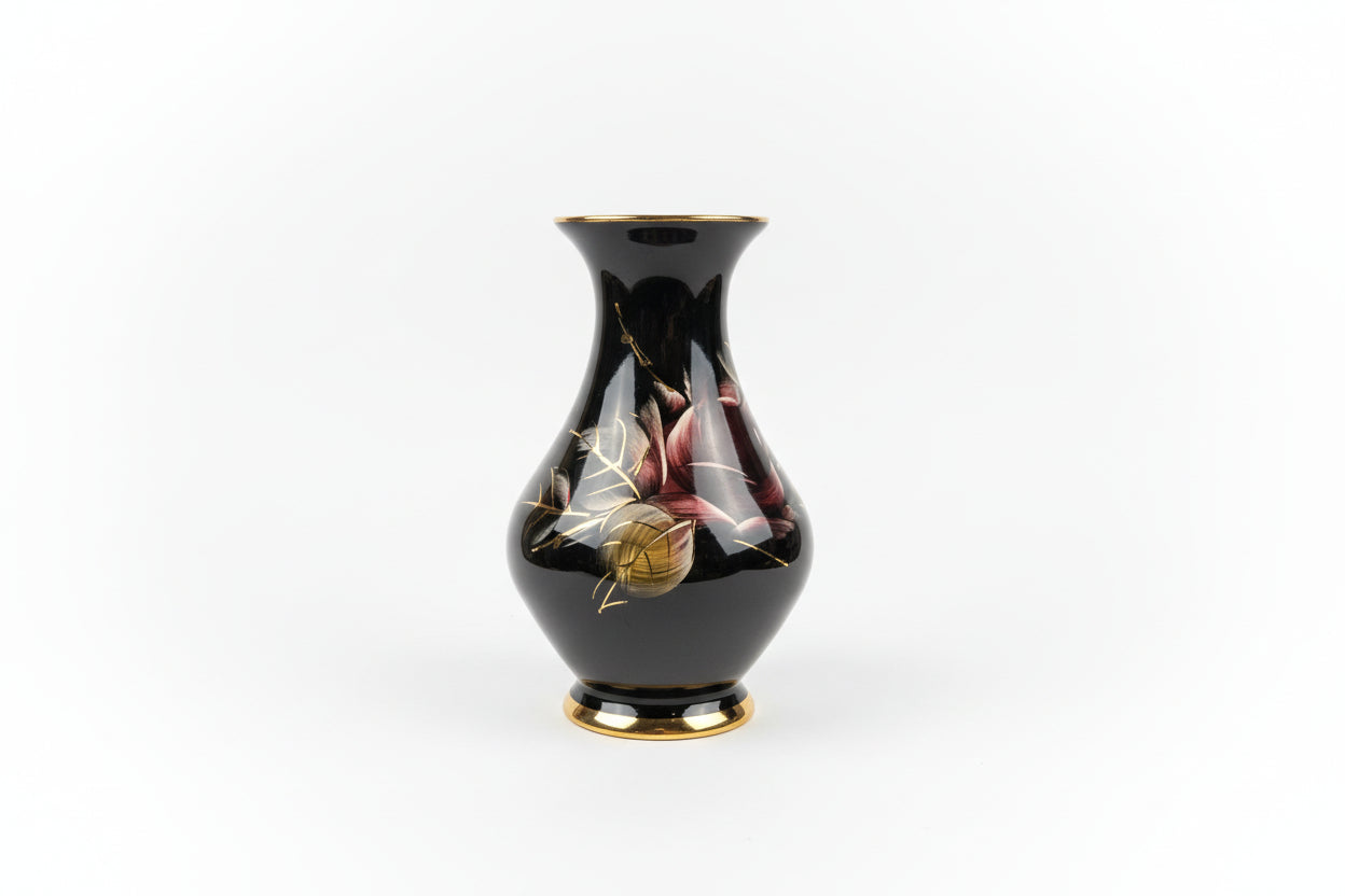 Black vase with floral design on a white background