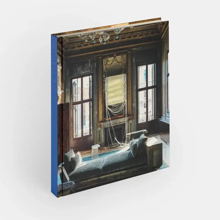 Cover image of Italian Interiors: Rooms With A View by Phaidon, showcasing a stylish interior room with large windows and scenic views.