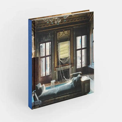 Cover image of Italian Interiors: Rooms With A View by Phaidon, showcasing a stylish interior room with large windows and scenic views.