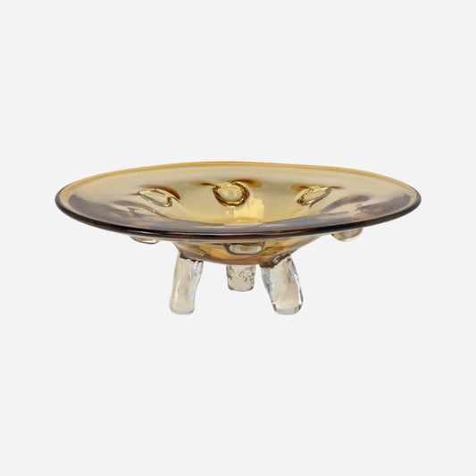 Decorative glass dish with a gold rim and clear base on a white background