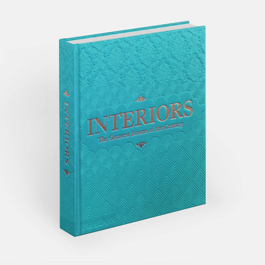 Sky blue cover of "Interiors: The Greatest Rooms of the Century" book by Phaidon, showcasing elegant room designs.