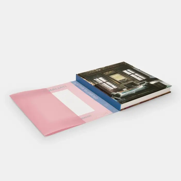 Cover image of "Italian Interiors: Rooms With A View" book by Phaidon, featuring a stylish Italian interior room with large windows.
