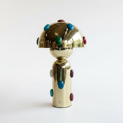 P. Grunsfeld Stoner Brass Wireless Lamp by The Vault Creative, featuring a sleek brass design and modern wireless functionality.