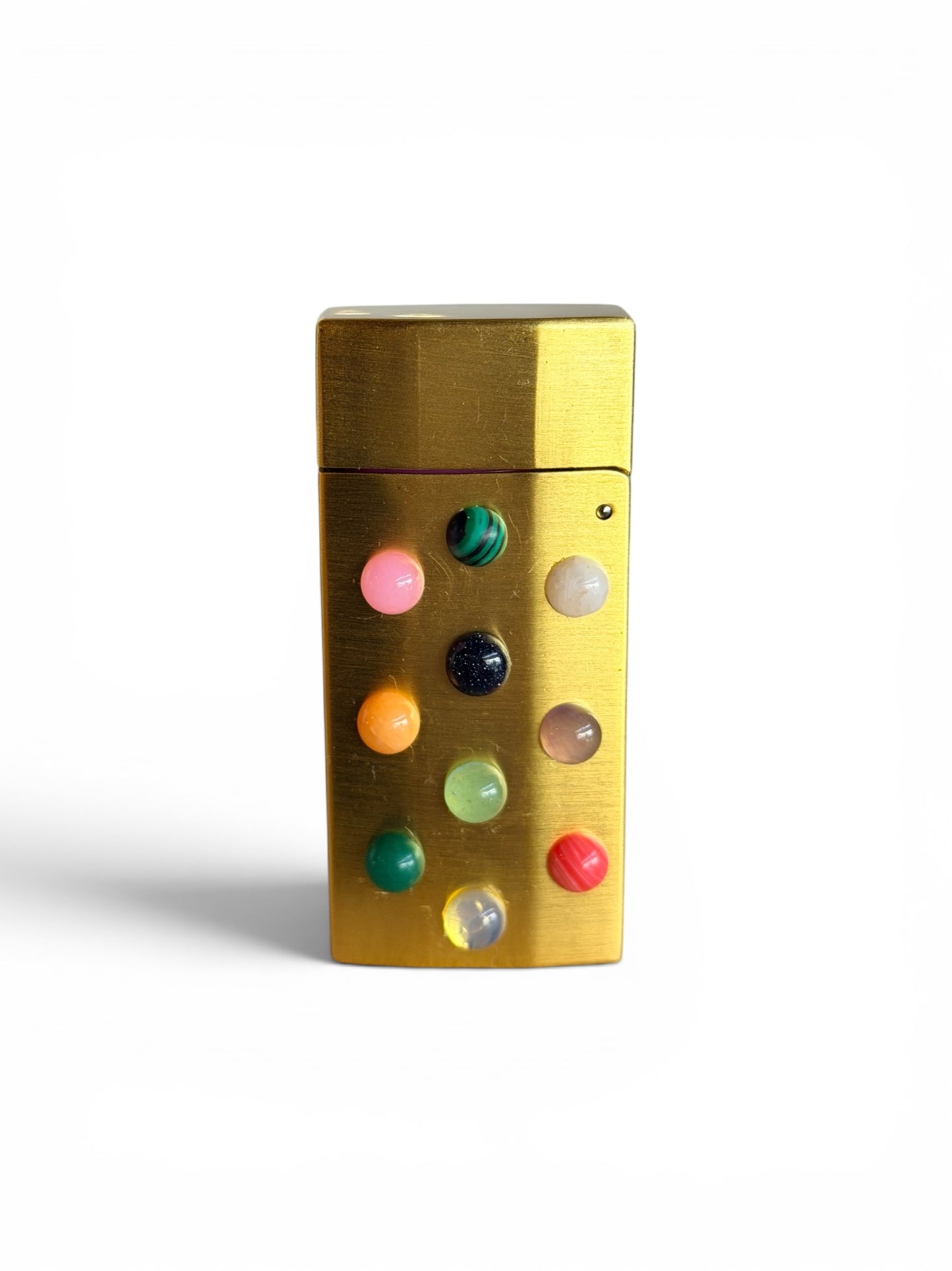 Multi-color Stoner Lighter by P. Grunsfeld from The Vault Creative, featuring a vibrant, colorful design on a sleek lighter.