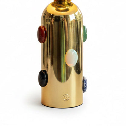 P. Grunsfeld Stoner Brass Wireless Lamp by The Vault Creative showing a sleek brass table lamp with wireless charging pad and modern design