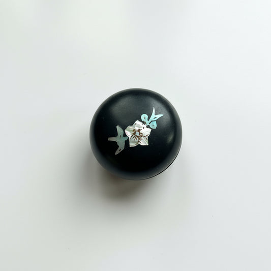 Black round box with floral design 