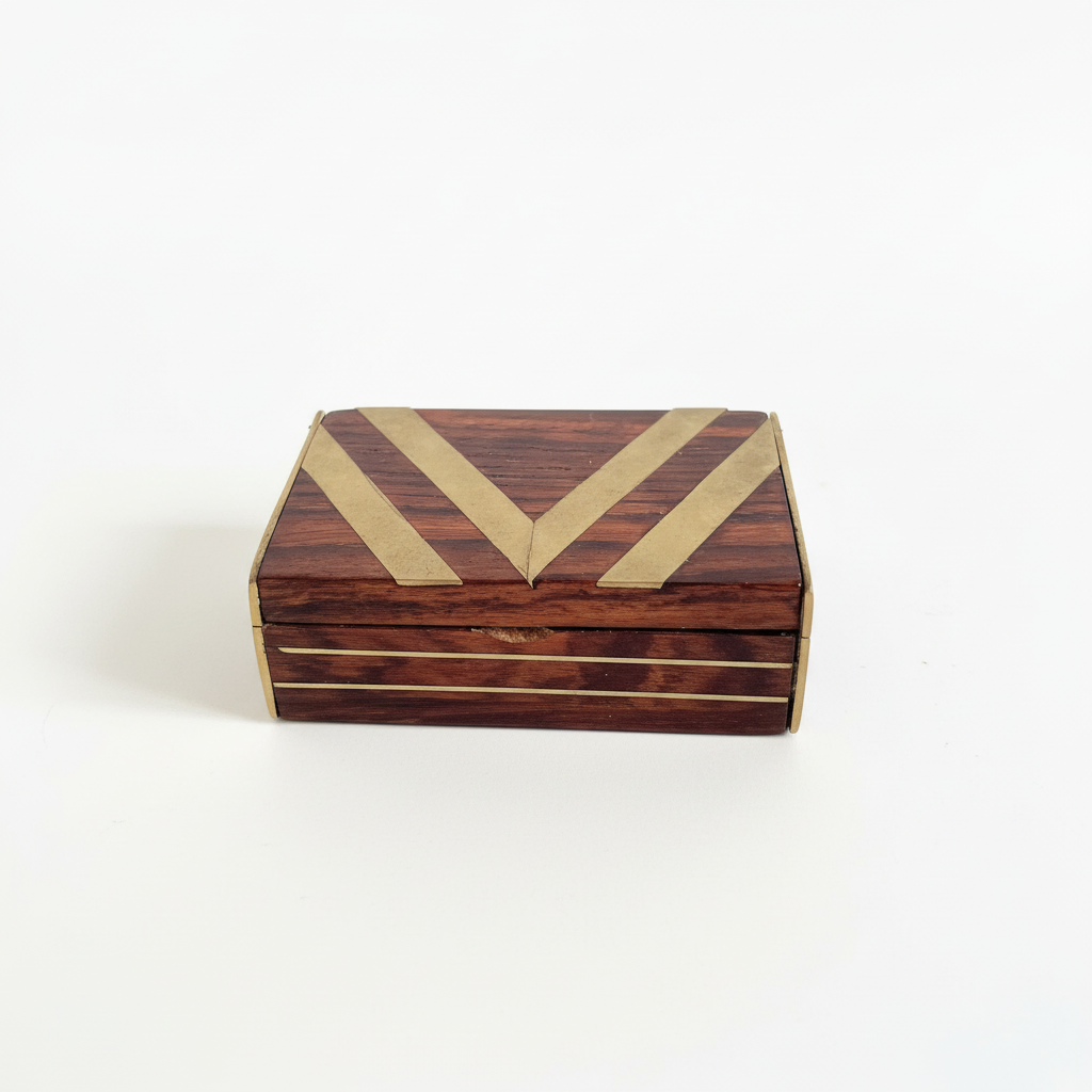 Wooden blov with a gold 'V' 