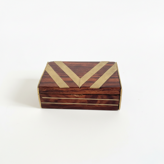 Wooden blov with a gold 'V' 