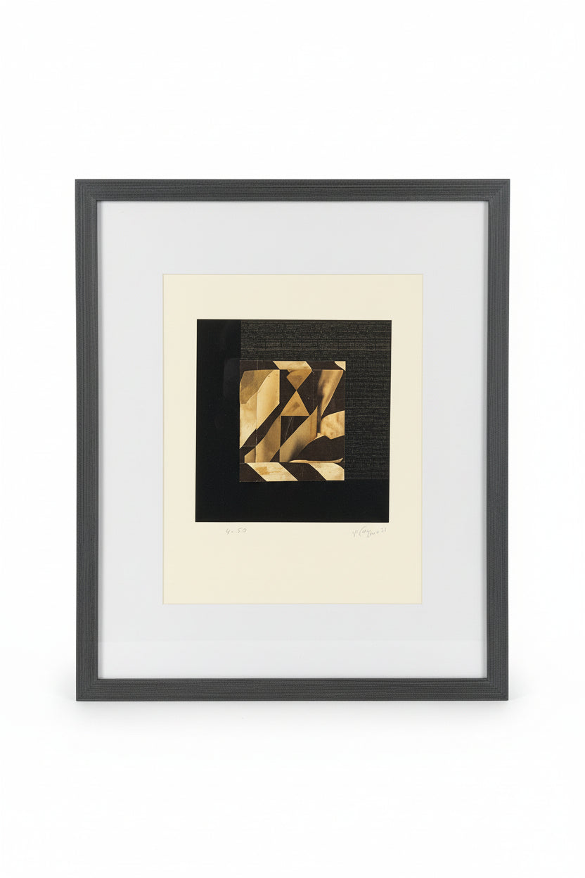 Framed artwork with geometric design on a dark background
