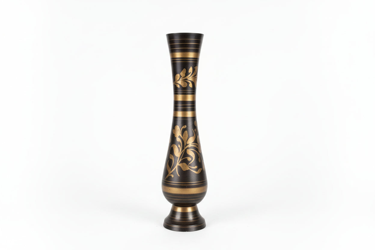 Decorative vase with black and gold design on a white background