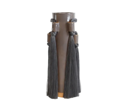 Brown vase with gray tassels on a white background