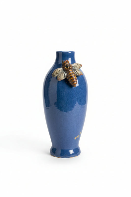 Blue ceramic bottle with bee as adecorative elements 